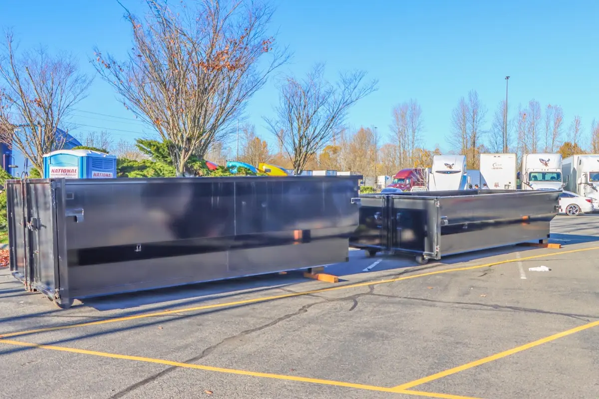 Professional dumpster rental service with roll-off container on residential driveway in Murphysboro